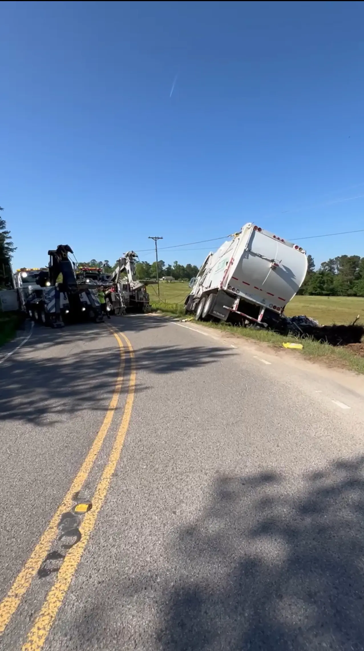 Tow trucks pulling stuck vehicle