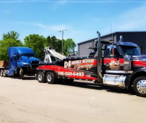 Towing service hauling broken truck