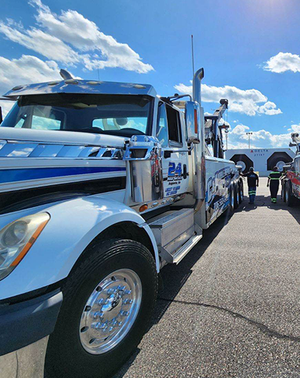 Towing truck under blue sky