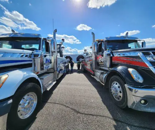 Tow trucks under blue sky