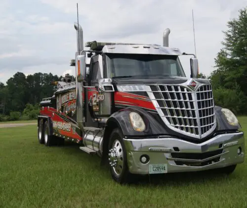 Tow truck parked on grass